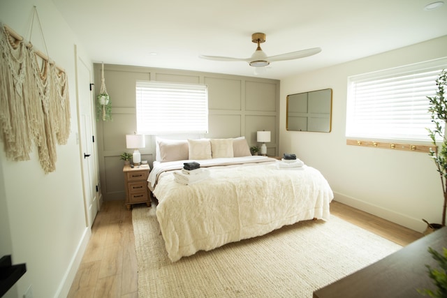 853 Thurman Ave, Columbus, OH 43206 - bedroom with light wood-style flooring, multiple windows, and a ceiling fan