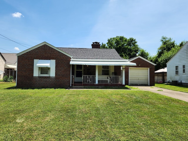 850 Grafton Rd, Newark, OH 43055 - view of front facade with a front lawn, brick siding, concrete driveway, a chimney, and covered porch
