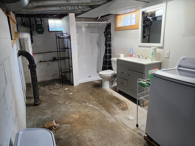 850 Grafton Rd, Newark, OH 43055 - bathroom with washer / clothes dryer, concrete flooring, a shower stall, and vanity