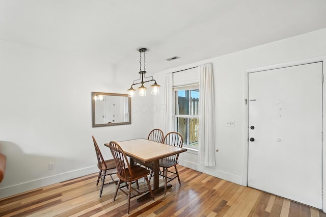 253 Kossuth St Unit H, Columbus, OH 43223 - dining area with light wood-style floors and baseboards