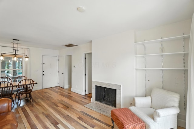 253 Kossuth St Unit H, Columbus, OH 43223 - living room featuring light wood-style floors and a fireplace with flush hearth