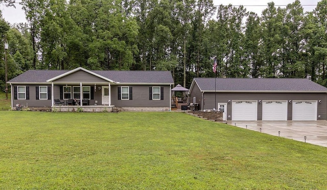 19366 Laurel Run Rd, Nelsonville, OH 45764 - ranch-style home featuring covered porch, a front yard, a garage, and view of scattered trees