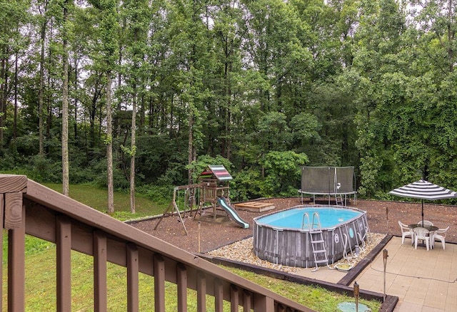 19366 Laurel Run Rd, Nelsonville, OH 45764 - outdoor pool featuring a trampoline, a playground, and a patio area