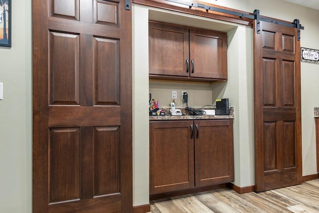 19366 Laurel Run Rd, Nelsonville, OH 45764 - bar area with a barn door and light wood-style floors