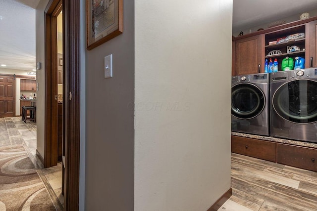 19366 Laurel Run Rd, Nelsonville, OH 45764 - washroom featuring washer and clothes dryer, cabinet space, recessed lighting, and a barn door