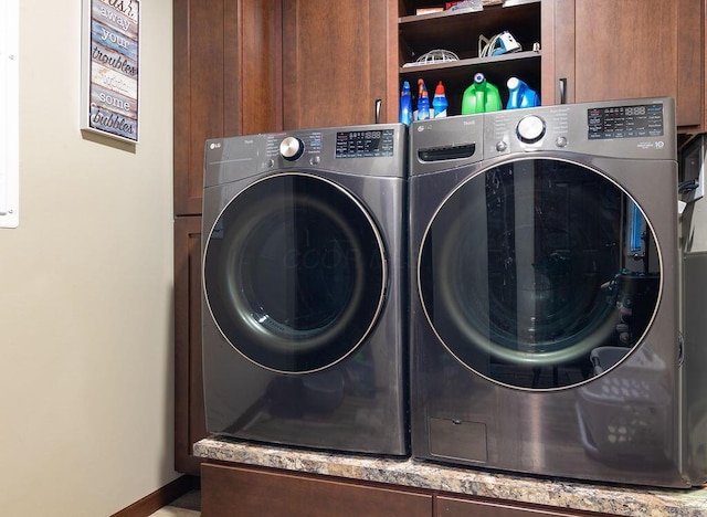 19366 Laurel Run Rd, Nelsonville, OH 45764 - laundry room featuring cabinet space and separate washer and dryer