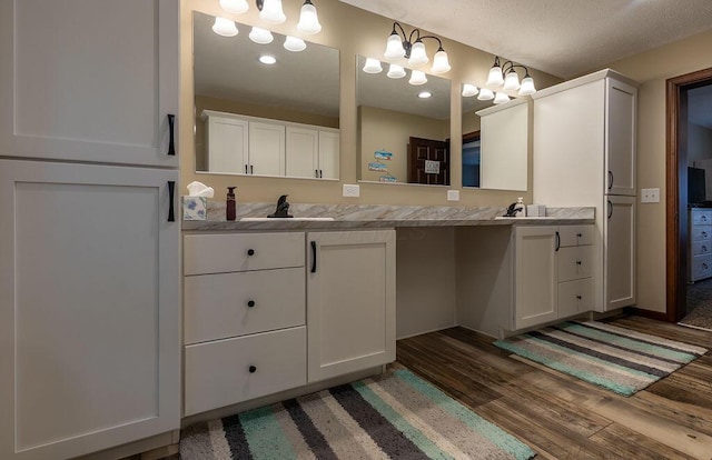 19366 Laurel Run Rd, Nelsonville, OH 45764 - bathroom with double vanity and wood finished floors