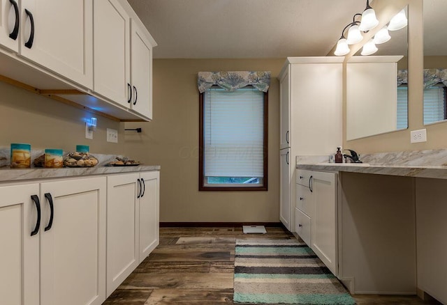 19366 Laurel Run Rd, Nelsonville, OH 45764 - kitchen with dark wood finished floors, white cabinetry, and light countertops