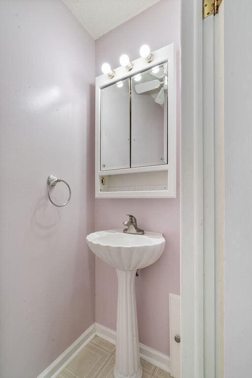 99 Maple Ave, Chillicothe, OH 45601 - bathroom with baseboards