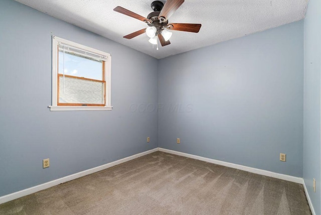 99 Maple Ave, Chillicothe, OH 45601 - carpeted spare room with ceiling fan and a textured ceiling
