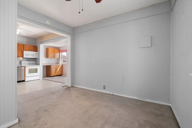 99 Maple Ave, Chillicothe, OH 45601 - unfurnished living room featuring a ceiling fan and light colored carpet