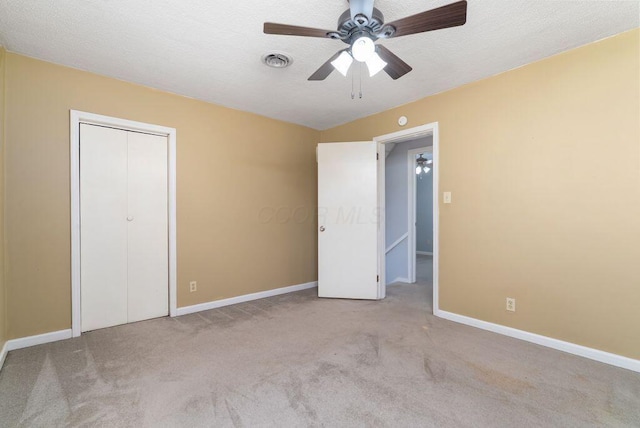 99 Maple Ave, Chillicothe, OH 45601 - unfurnished bedroom featuring carpet floors, ceiling fan, a closet, and a textured ceiling