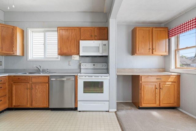99 Maple Ave, Chillicothe, OH 45601 - kitchen featuring white appliances, light countertops, brown cabinets, and light floors