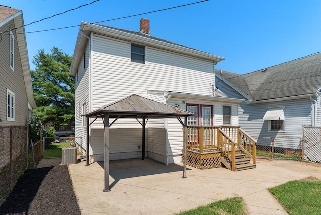 99 Maple Ave, Chillicothe, OH 45601 - rear view of house with a gazebo, a patio, and a chimney