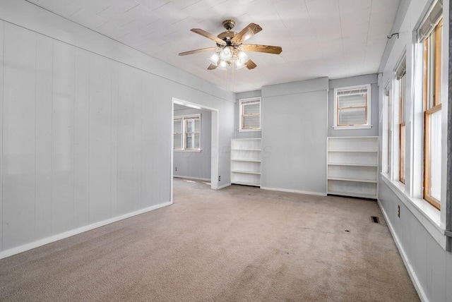 99 Maple Ave, Chillicothe, OH 45601 - unfurnished bedroom featuring multiple windows, carpet floors, and a ceiling fan