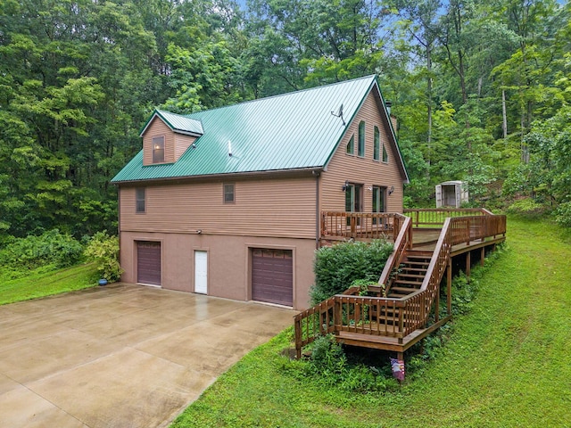 3857 US Highway 23, Chillicothe, OH 45601 - view of home's exterior with an attached garage, stairs, a wooden deck, and a lawn