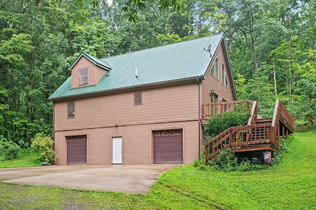3857 US Highway 23, Chillicothe, OH 45601 - view of property exterior with a garage, driveway, a lawn, a metal roof, and stairs