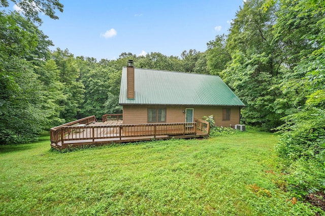 3857 US Highway 23, Chillicothe, OH 45601 - rear view of property featuring a chimney, a yard, a metal roof, and a deck