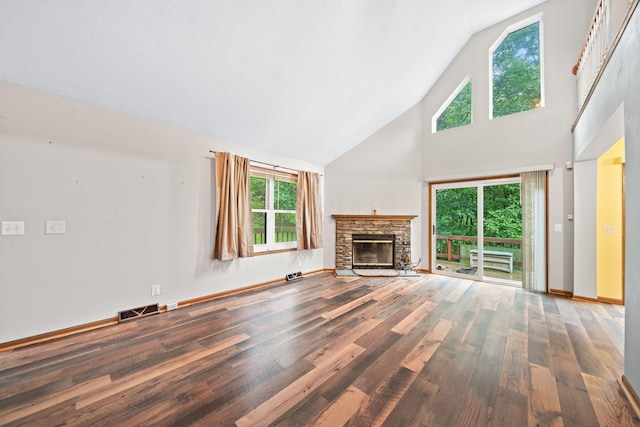 3857 US Highway 23, Chillicothe, OH 45601 - unfurnished living room featuring wood finished floors, high vaulted ceiling, and a fireplace