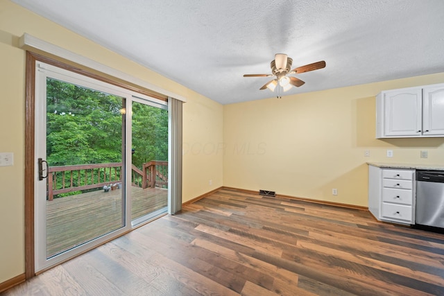 3857 US Highway 23, Chillicothe, OH 45601 - unfurnished dining area with wood finished floors, ceiling fan, and a textured ceiling