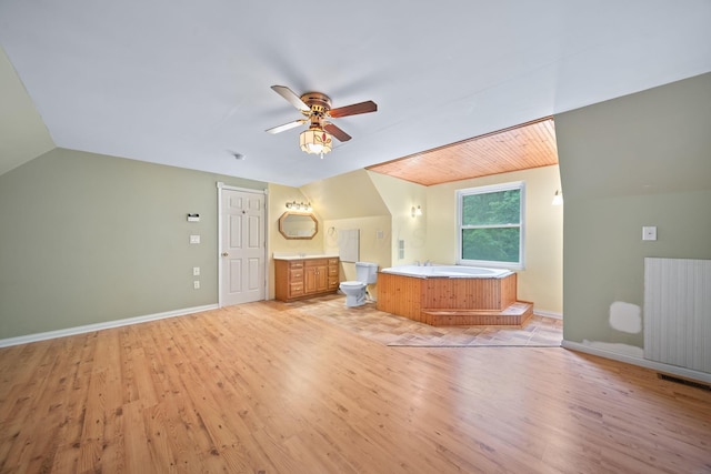 3857 US Highway 23, Chillicothe, OH 45601 - full bathroom featuring vaulted ceiling, wood finished floors, ceiling fan, vanity, and a bath