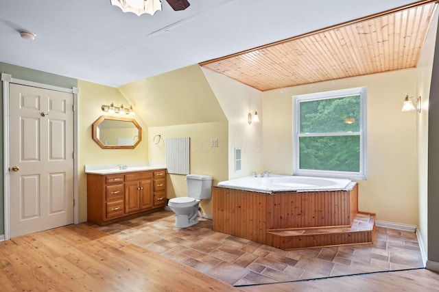 3857 US Highway 23, Chillicothe, OH 45601 - full bathroom featuring vanity, a bath, and vaulted ceiling