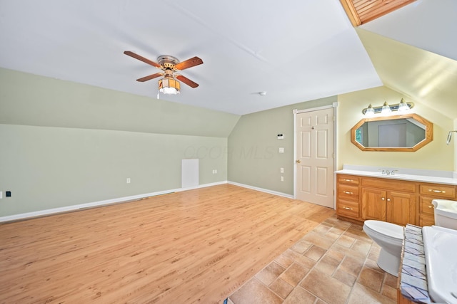 3857 US Highway 23, Chillicothe, OH 45601 - bathroom featuring vanity, lofted ceiling, a ceiling fan, and wood finished floors