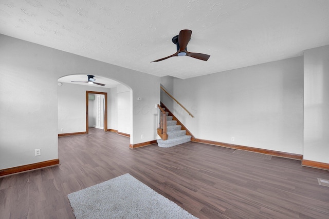 898-900 Berkeley Rd, Columbus, OH 43206 - unfurnished living room with ceiling fan, wood finished floors, arched walkways, stairs, and a textured ceiling