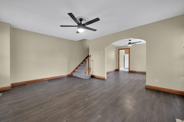 898-900 Berkeley Rd, Columbus, OH 43206 - unfurnished room with a ceiling fan, arched walkways, dark wood finished floors, and stairs