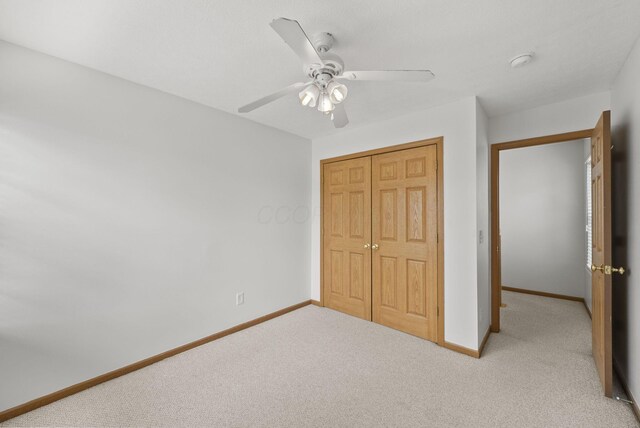 3734 Gibbstone Dr, Columbus, OH 43204 - unfurnished bedroom featuring carpet, a closet, and a ceiling fan