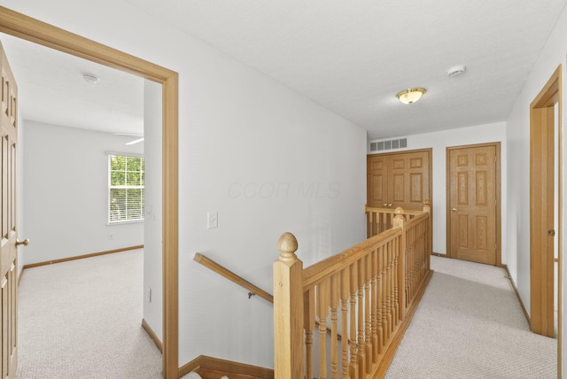 3734 Gibbstone Dr, Columbus, OH 43204 - hallway featuring an upstairs landing and light colored carpet