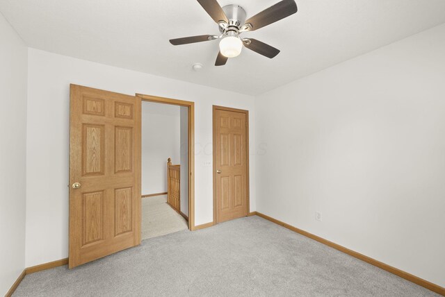 3734 Gibbstone Dr, Columbus, OH 43204 - unfurnished bedroom with light colored carpet and ceiling fan