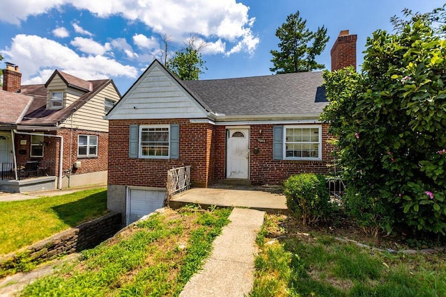 4747 Basil Ln, Cincinnati, OH 45238 - view of front facade featuring a garage, brick siding, a chimney, and roof with shingles