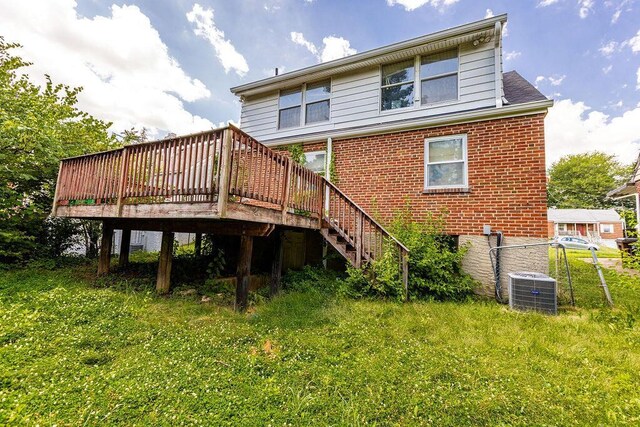4747 Basil Ln, Cincinnati, OH 45238 - rear view of property featuring a deck, brick siding, and stairs