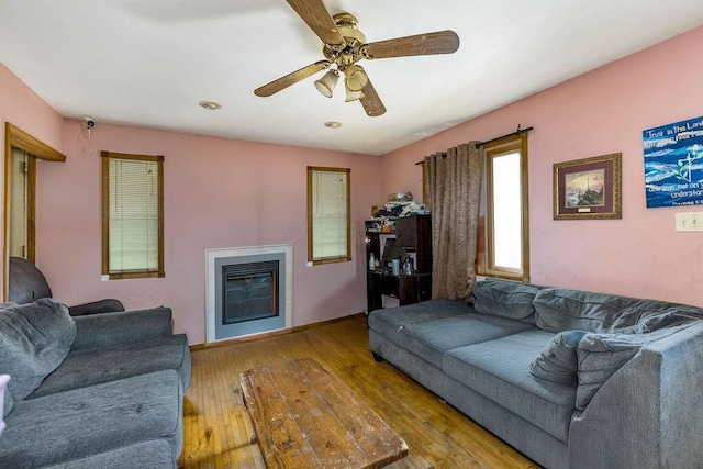 4747 Basil Ln, Cincinnati, OH 45238 - living area with hardwood / wood-style flooring, ceiling fan, and a glass covered fireplace