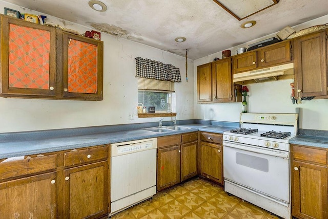 4747 Basil Ln, Cincinnati, OH 45238 - kitchen featuring white appliances, under cabinet range hood, and brown cabinets