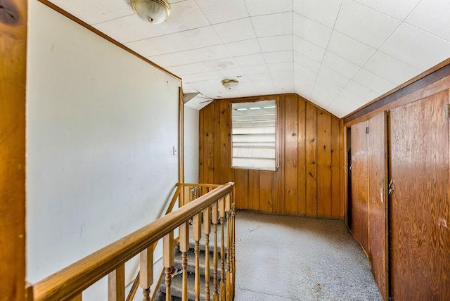 4747 Basil Ln, Cincinnati, OH 45238 - corridor featuring vaulted ceiling, carpet flooring, wood walls, and an upstairs landing