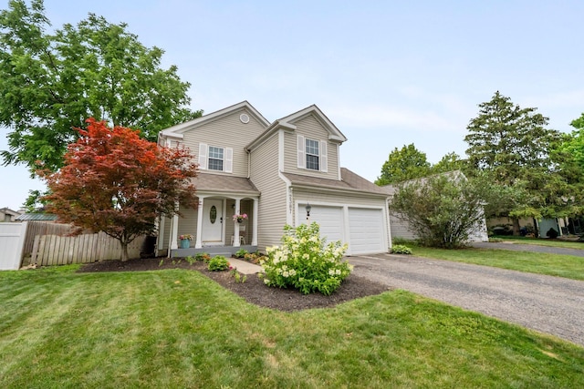 2387 Sutter Pkwy, Dublin, OH 43016 - traditional home featuring asphalt driveway, a garage, a porch, and a shingled roof