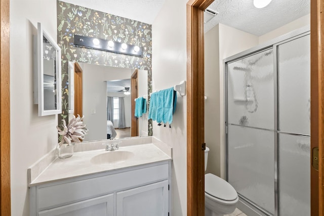 2387 Sutter Pkwy, Dublin, OH 43016 - full bathroom with ensuite bath, a shower stall, vanity, a textured ceiling, and a ceiling fan