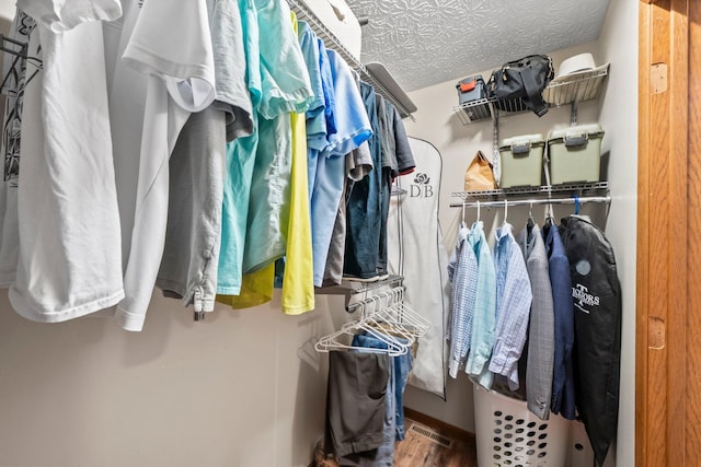 2387 Sutter Pkwy, Dublin, OH 43016 - walk in closet featuring wood finished floors