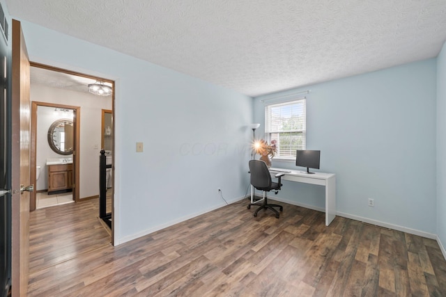 2387 Sutter Pkwy, Dublin, OH 43016 - office area with wood finished floors and a textured ceiling