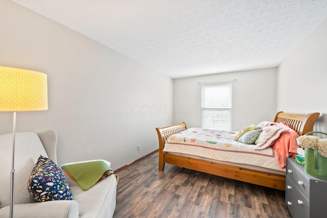 2387 Sutter Pkwy, Dublin, OH 43016 - bedroom featuring wood finished floors and a textured ceiling