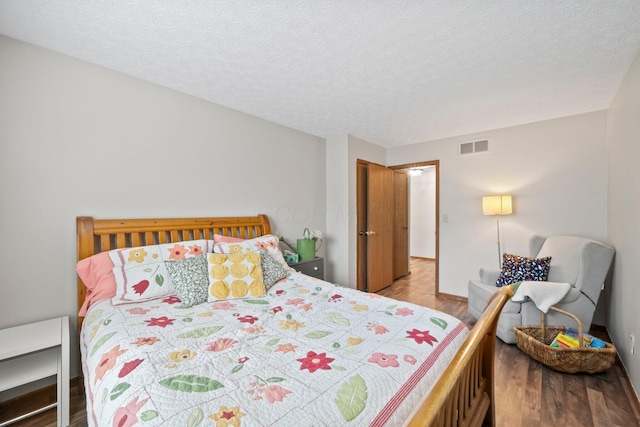 2387 Sutter Pkwy, Dublin, OH 43016 - bedroom with wood finished floors and a textured ceiling