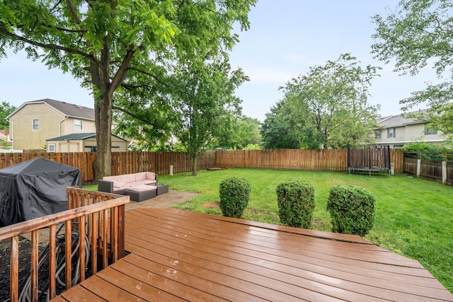 2387 Sutter Pkwy, Dublin, OH 43016 - wooden deck featuring a fenced backyard, a trampoline, and an outdoor living space