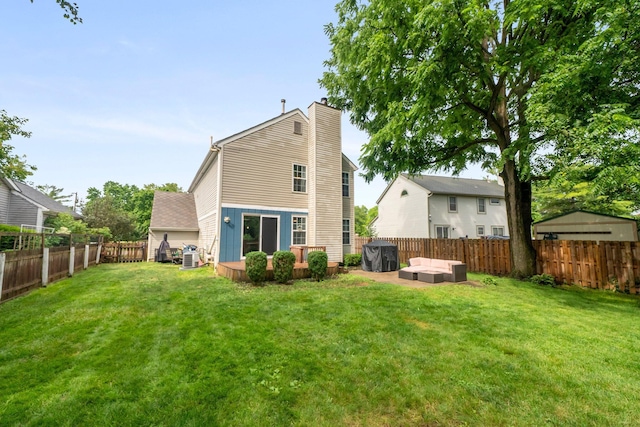 2387 Sutter Pkwy, Dublin, OH 43016 - back of house with a chimney, a fenced backyard, and an outdoor living space