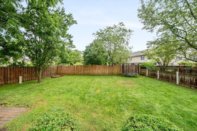 2387 Sutter Pkwy, Dublin, OH 43016 - fenced backyard with a trampoline