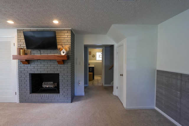 5081 Mengel Ln, Hilliard, OH 43026 - unfurnished living room featuring carpet flooring, a textured ceiling, and a brick fireplace