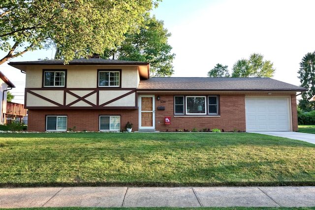 5081 Mengel Ln, Hilliard, OH 43026 - split level home featuring a garage, brick siding, a front yard, and stucco siding