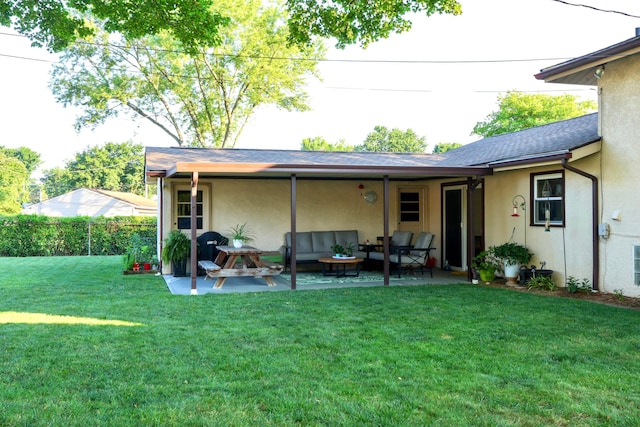 5081 Mengel Ln, Hilliard, OH 43026 - rear view of property featuring outdoor lounge area, stucco siding, and a patio