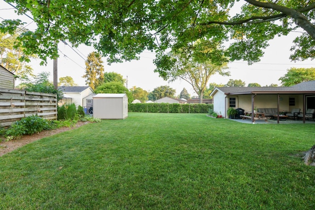 5081 Mengel Ln, Hilliard, OH 43026 - fenced backyard featuring a storage shed, an outdoor living space, and a patio